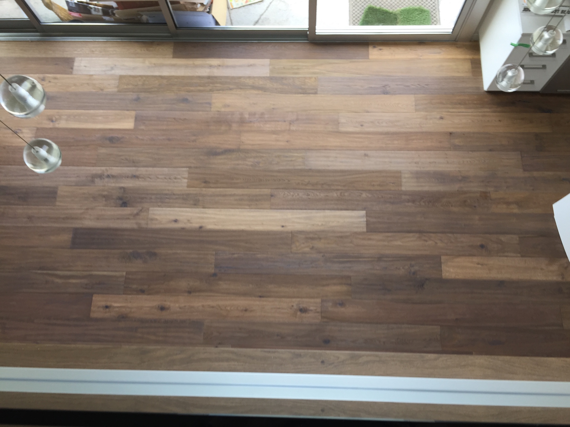 Gibsons House — top-down view of character white oak plank flooring detail