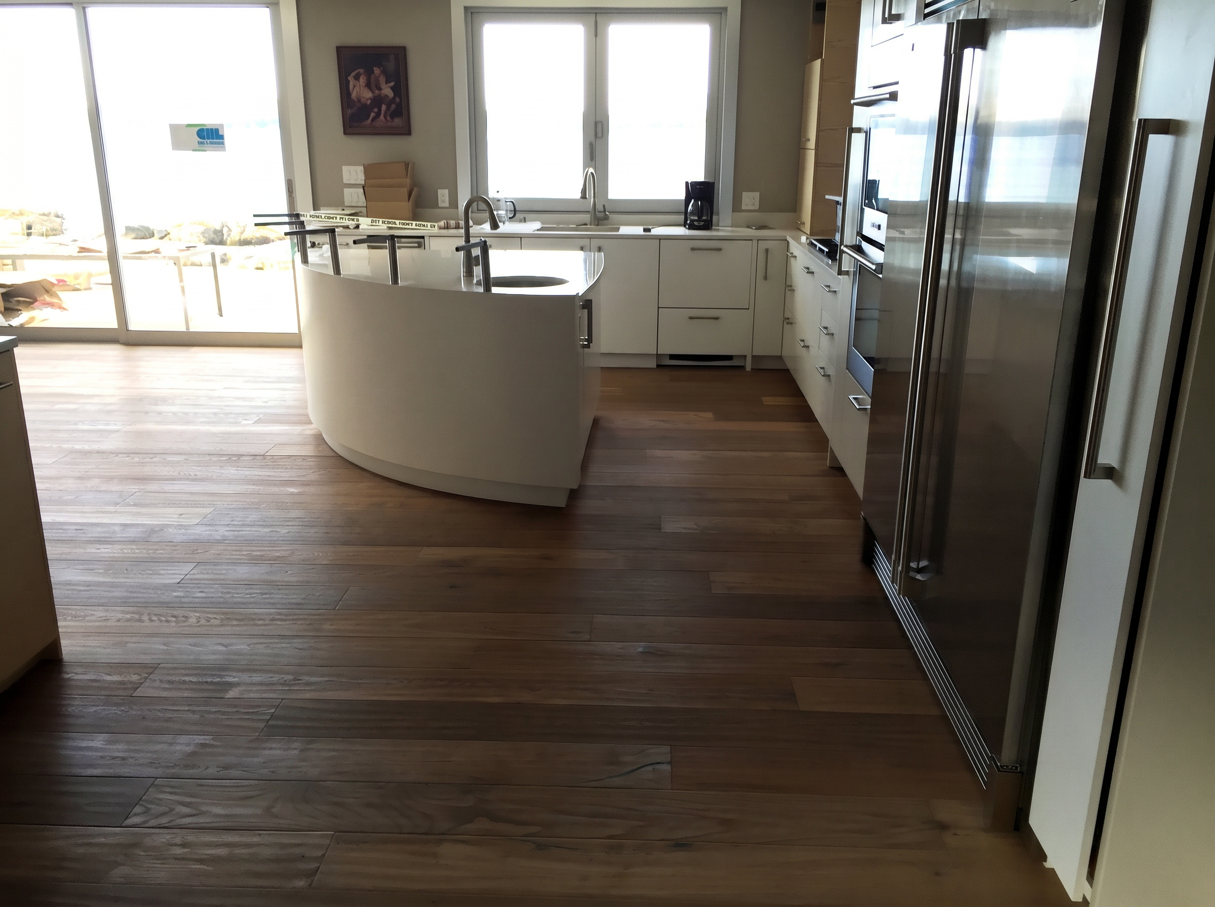 Gibsons House — wide-plank white oak hardwood in waterfront kitchen with ocean view