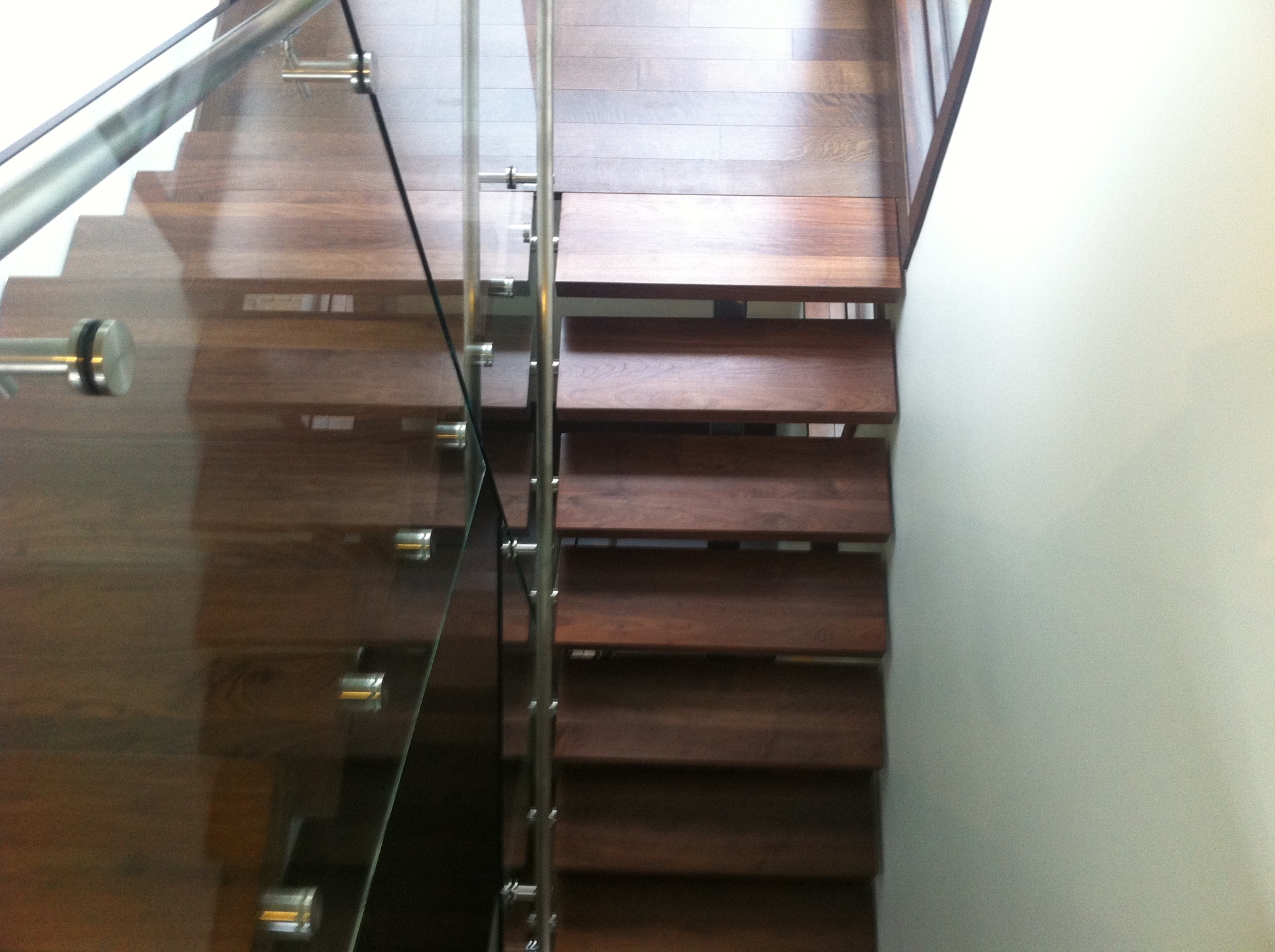 West Vancouver Home — Vintage walnut open-riser staircase with glass and stainless railings
