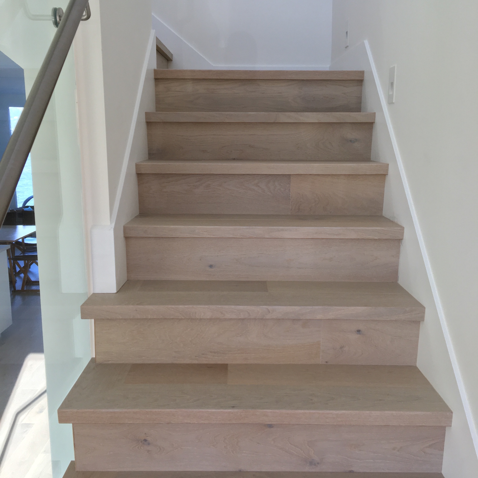 Point Grey Rd Vancouver Home — solid white oak stair treads and risers with glass railing