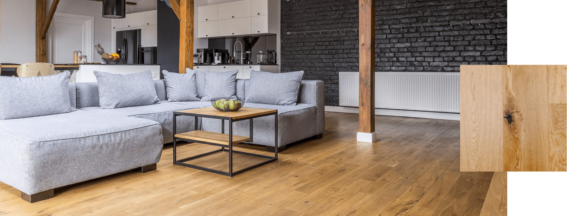 Wide-plank engineered hardwood floor in a sunlit modern living room